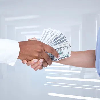 Shaking hands while holding money