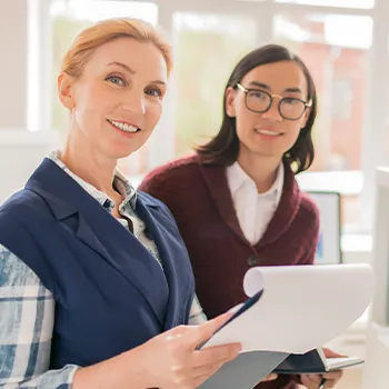 Two women smiling on the camera