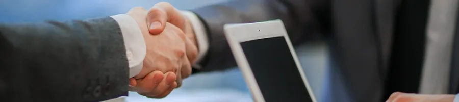 Shaking hands with another businessman