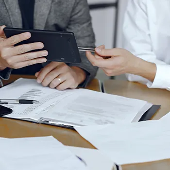 A businessperson explaining the files