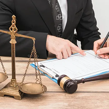 An LLC owner signing a document due to a suit