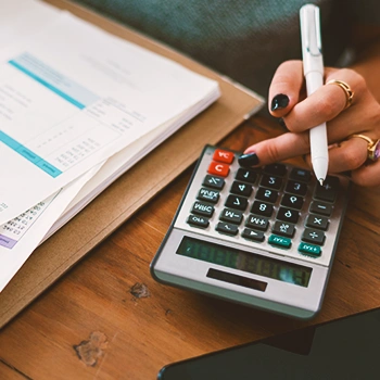 A woman using a calculator