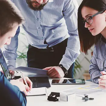 Office workers collaborating on dissolving an LLC in Arizona