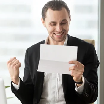 Happy working man receiving document