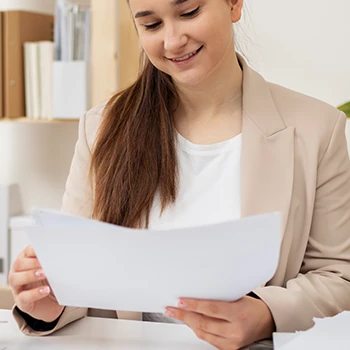A woman studying an LLC operating agreement