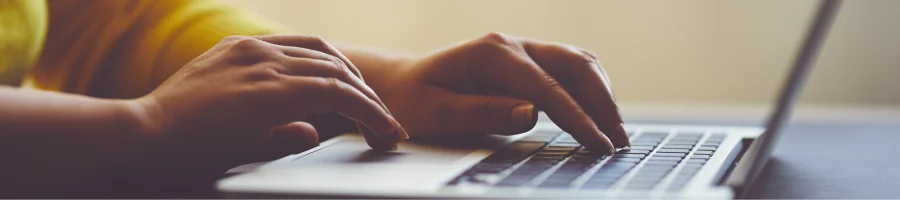 Person behind a laptop