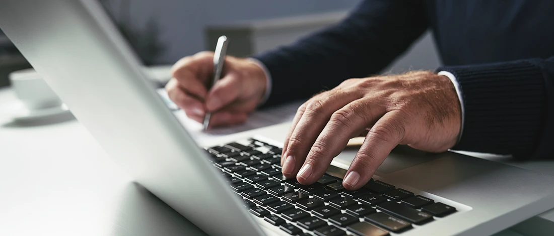 Venture Smarter | How to Look up an LLC in Wisconsin? (A Complete Guide) A business man writing down how to look up an LLC in Wisconsin