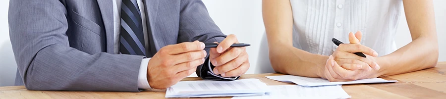 A man and a woman talking about the benefits when you hire InCorp