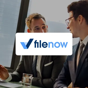 Venture Smarter | FileNow Review (2025 Updated) All You Need to Know FileNow logo with a background of two business men having a conversation in an office