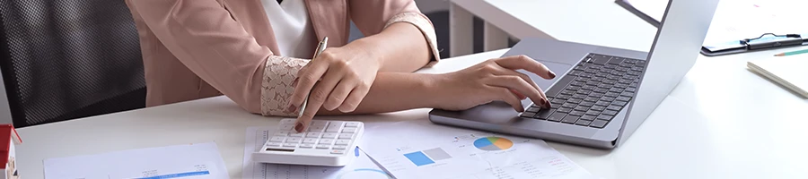 A working business woman computing the cost of an LLC in Maryland