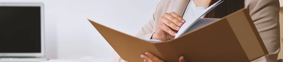 A person looking at the paperwork for starting an LLC in Mississippi