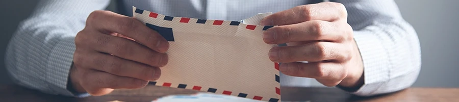 Registered agent opening a letter