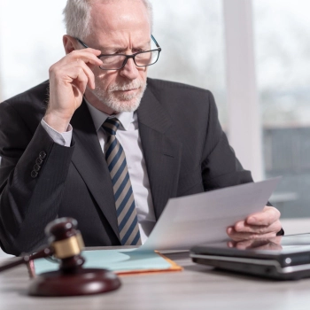 Man looking at a legal document to change a registered agent In Nebraska