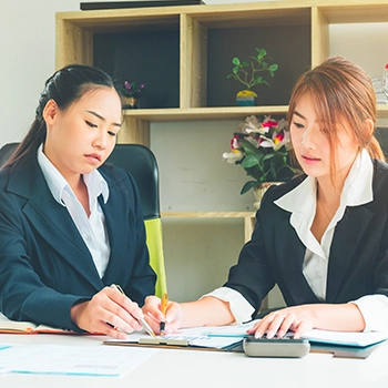 Two workers using a registered agent service