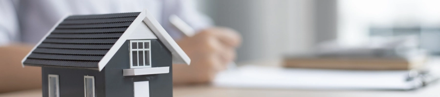 House on a table showing who can be a Nebraska registered agent