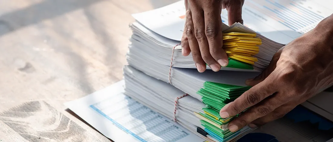 Venture Smarter | How to Change an LLC Name in Wyoming? (Step by Step Guide) Changing LLC Name in Wyoming on stack of files