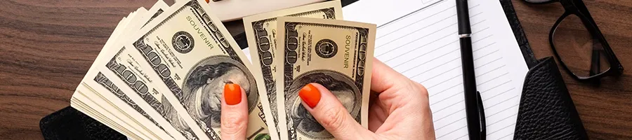 Top view of counting dollar bills