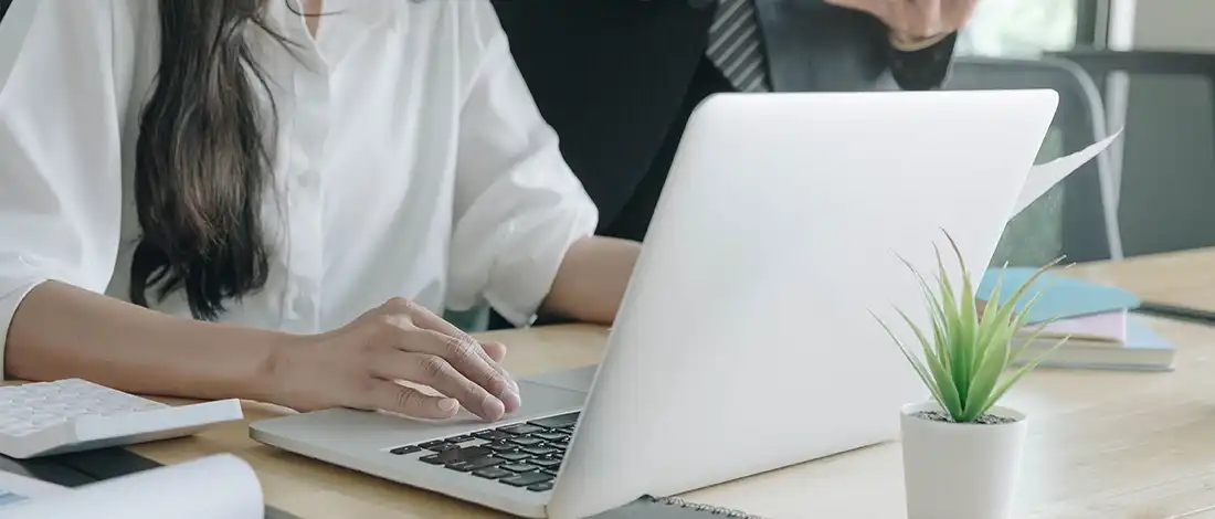 Venture Smarter | How to File LLC Taxes in Alabama? (Simple Guide) Using laptop to pass Alabama LLC Taxes requirement