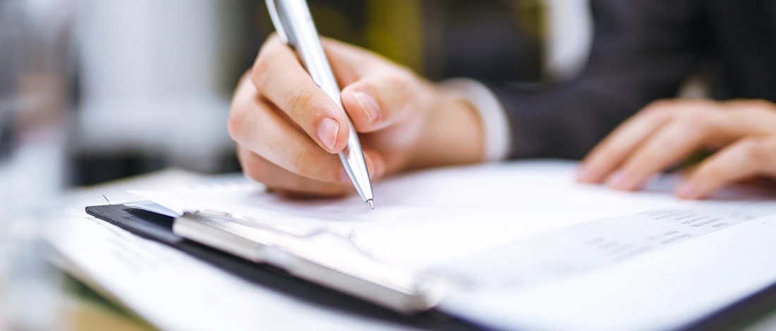 Venture Smarter | Cheapest Way To Start an LLC (Affordable Business Formation) Writing on a document to start LLC in the cheapest way