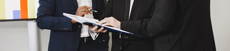 Group of businessman checking tax deductible in Idaho LLC