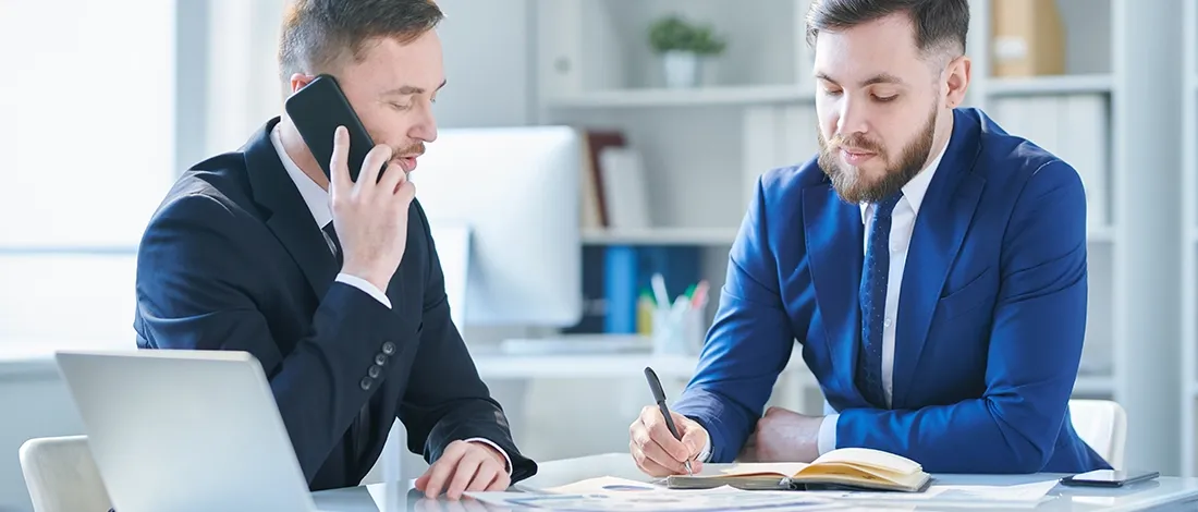 Venture Smarter | What is a Non-Resident Agent? (Exploring Responsibilities) Businessmen discussing about Non-Resident Agents