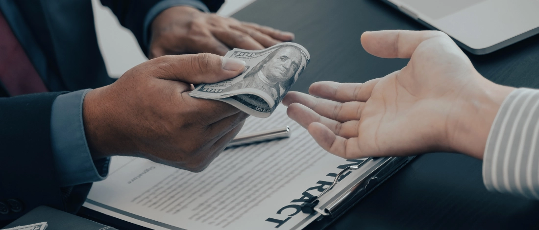 Venture Smarter | Delaware LLC Operating Agreement (Guide + Free Template) Handing money for an LLC operating agreement in Delaware