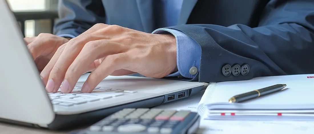 Venture Smarter | How to File LLC Taxes in New York? (Step by Step Guide) Using laptop for New York LLC taxes