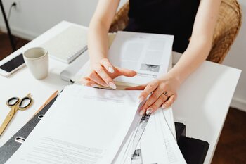 Woman looking at insurance papers